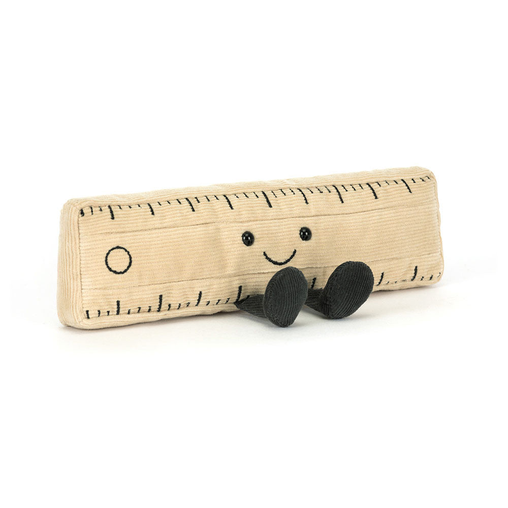 Toy ruler with a smiling face on a white background