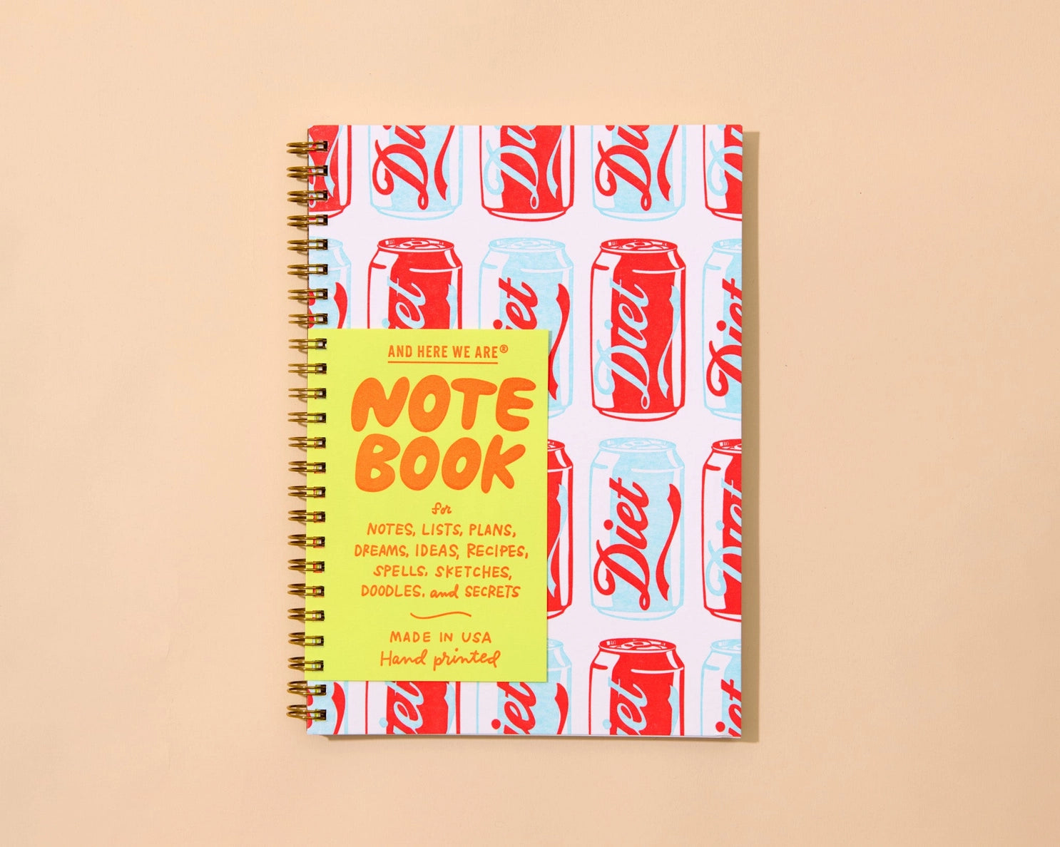 Notebook with Diet Coke can pattern on cover and yellow label