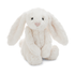 White plush bunny toy on a white background