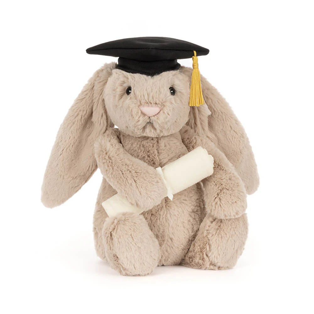 Plush bunny toy wearing a graduation cap and gown on a white background
