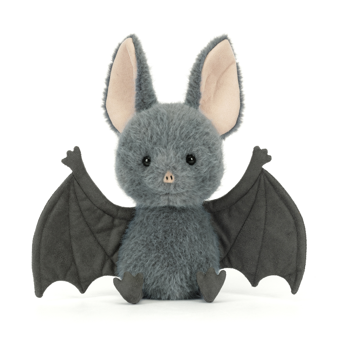 Plush toy bat with gray fur and black wings on a white background