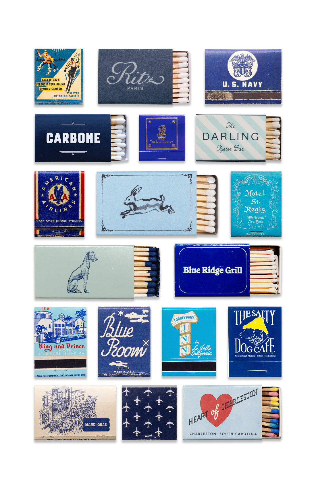 Collection of various matchboxes with different designs and text on a white background