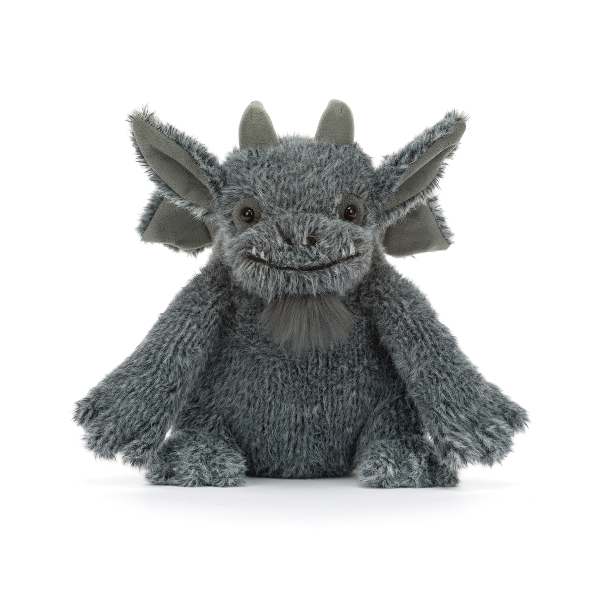 A gray plush dragon toy with large pointed ears, small horns, and a stitched smiling face, photographed against a clean white background.