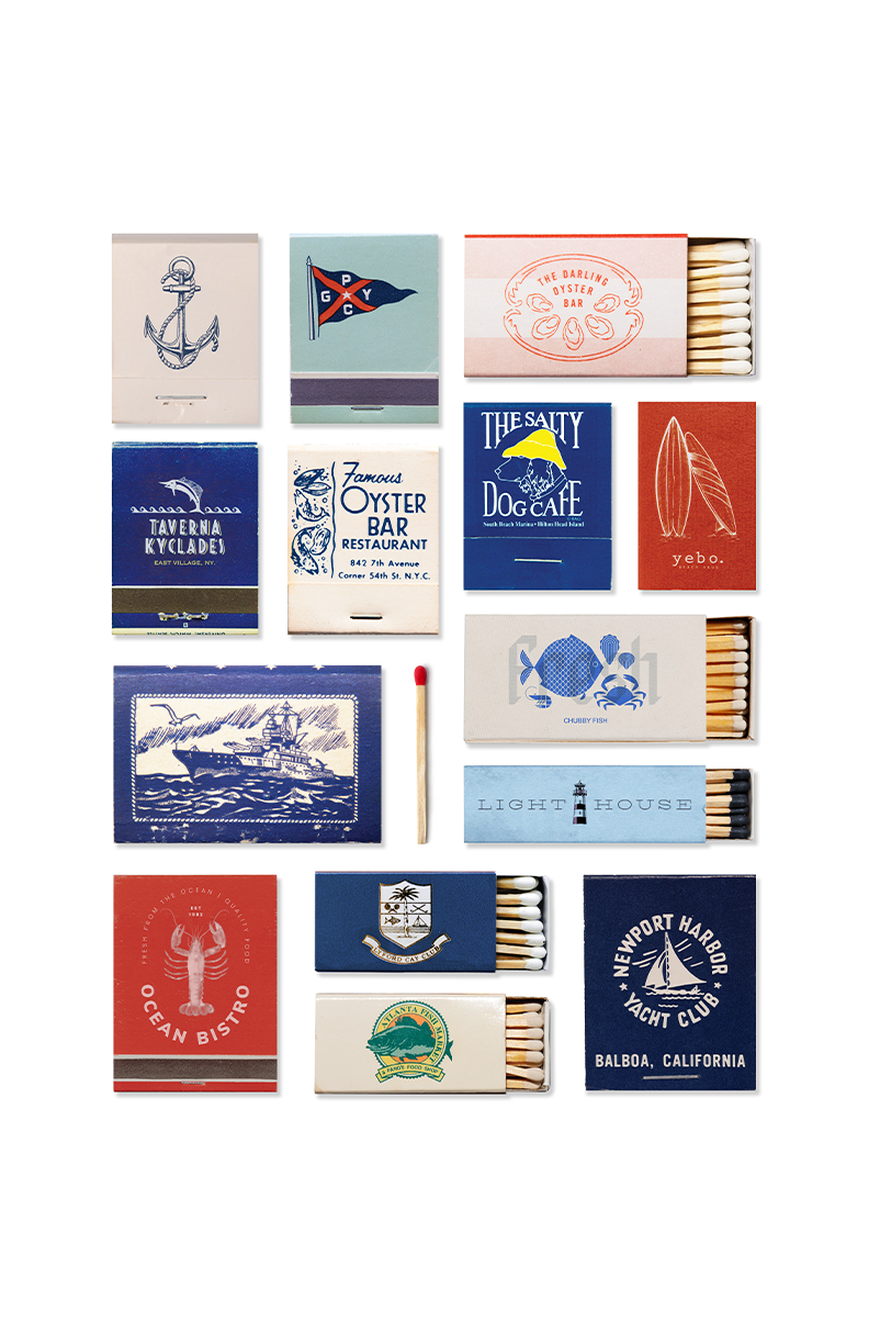 Collection of matchboxes with various designs on a white background