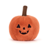 Plush pumpkin toy with a smiling face on a white background