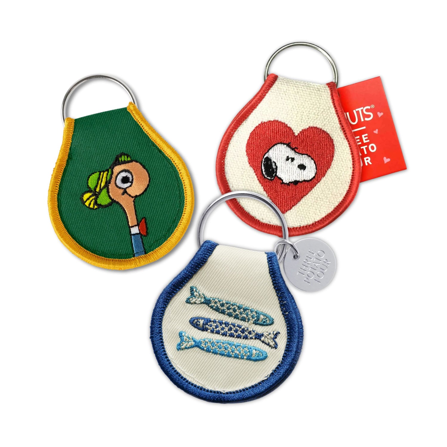 Three keychains with different designs on a white background