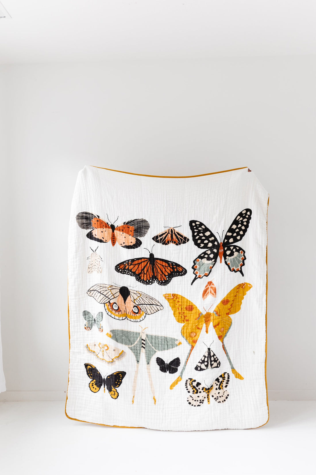 Blanket with butterfly designs on a white background