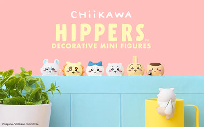 Decorative mini figures with a pink and blue background, featuring the brand &