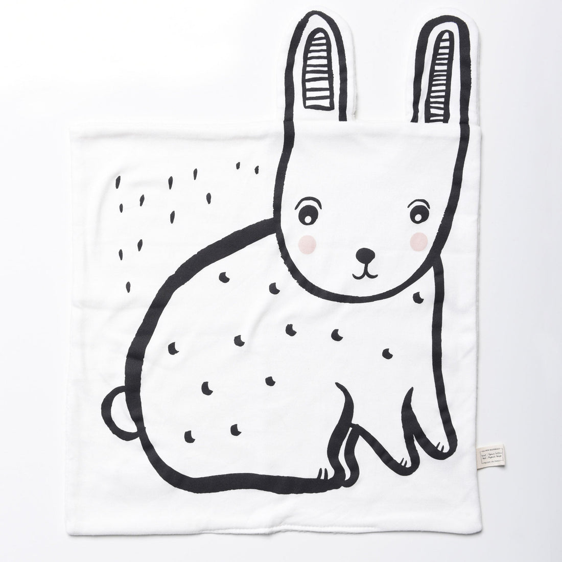 White blanket with a black outline of a rabbit on a white background